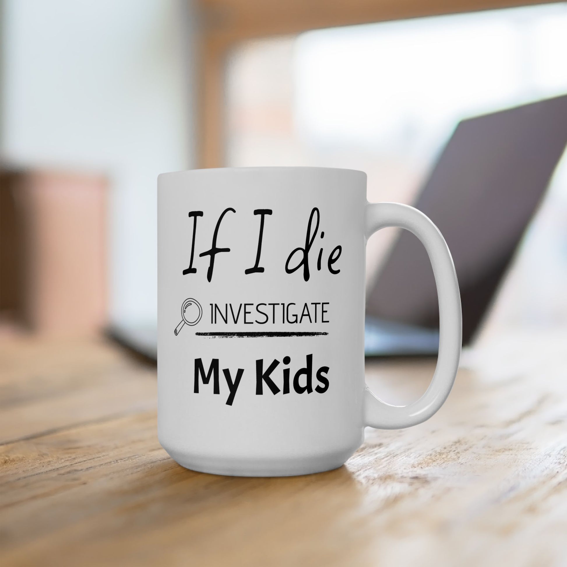 White mug with text 'If I die, investigate my kids' on a wooden surface.